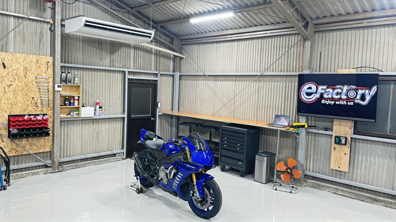 The eFactory workshop with a motorcycle and tools
